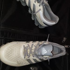 White and Grey Adidas Springblade tennis shoes